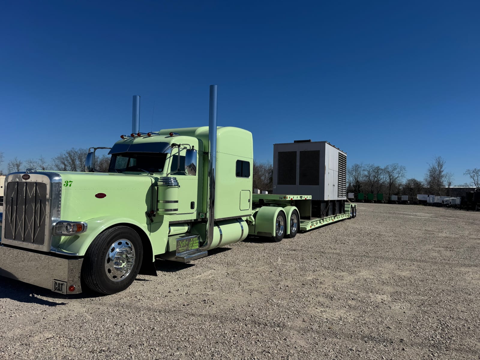 A carrier's rig hauling a VONEX-arranged load